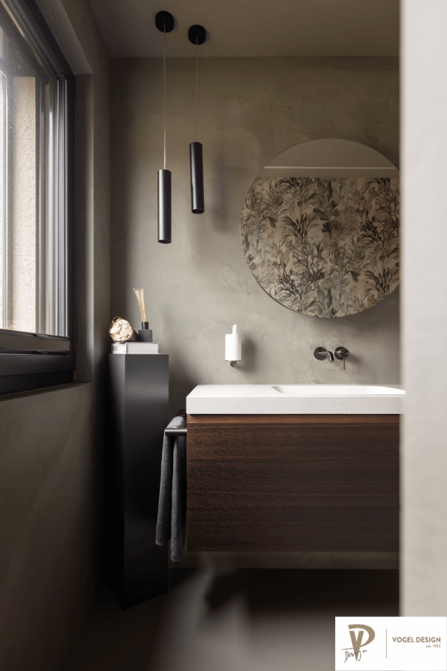 Badezimmer mit Rundspiegel in Schlammfarbe